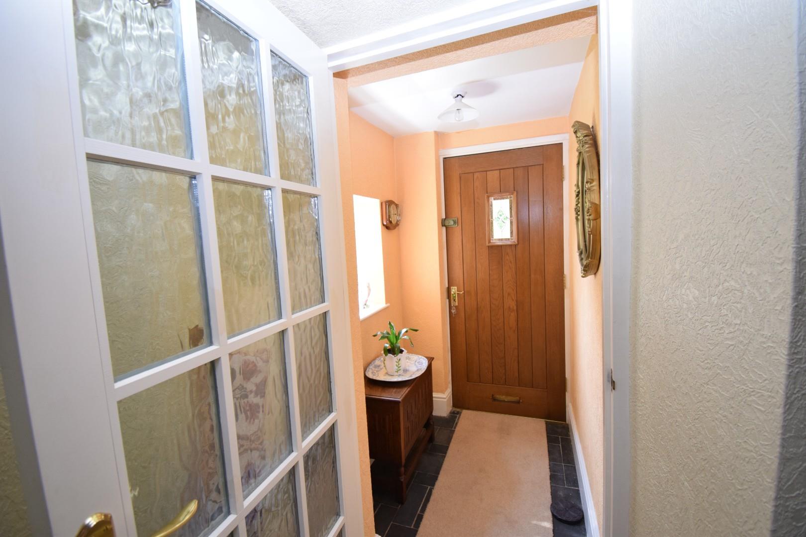 Entrance lobby opening to the:-